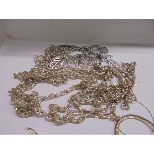 1141 - A quantity of assorted white metal chains, bangles etc.,