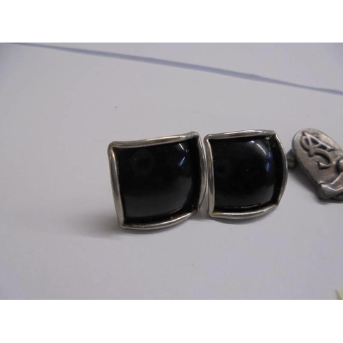 1145 - A pair of silver monogrammed cuff links, a silver ring set black stone and a pair of white metal cuf... 