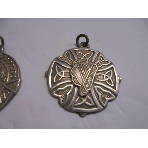 1148 - Two silver watch fobs featuring harps and another silver watch fob.