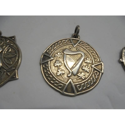 1148 - Two silver watch fobs featuring harps and another silver watch fob.