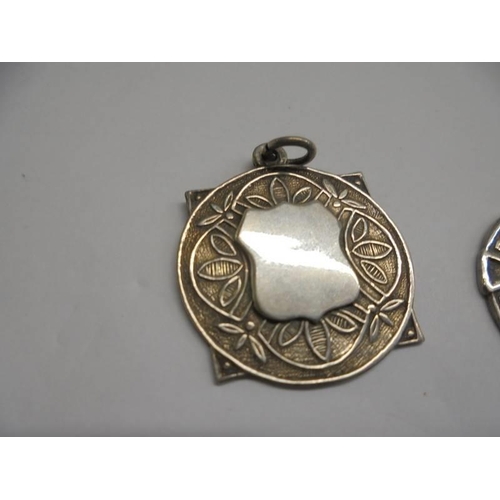 1148 - Two silver watch fobs featuring harps and another silver watch fob.