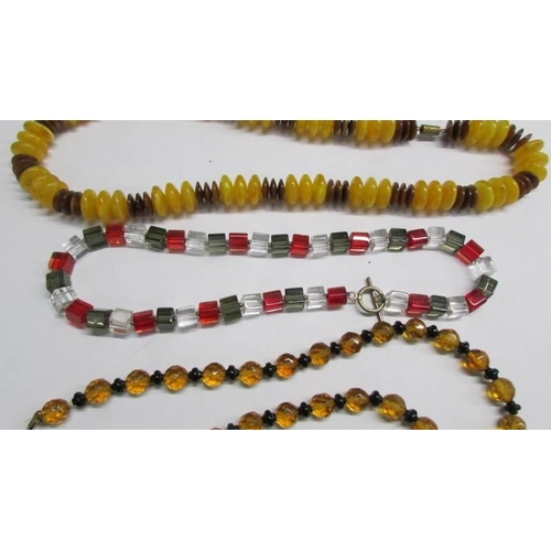 1152 - Four good bead necklaces and a pair of yellow metal earrings.