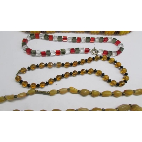 1152 - Four good bead necklaces and a pair of yellow metal earrings.