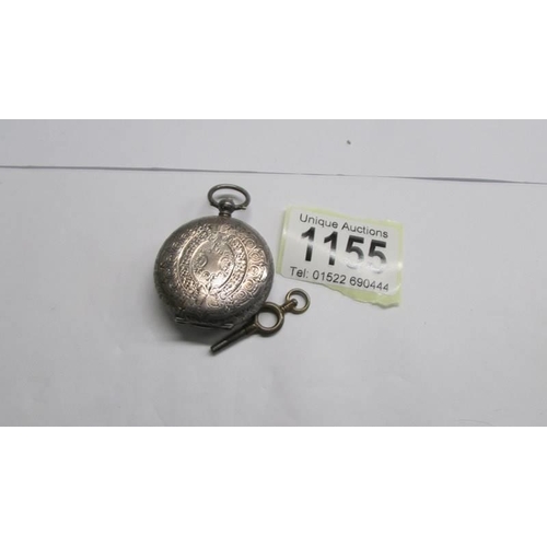 1155 - A Victorian lady's silver fob watch with key (needs attention).