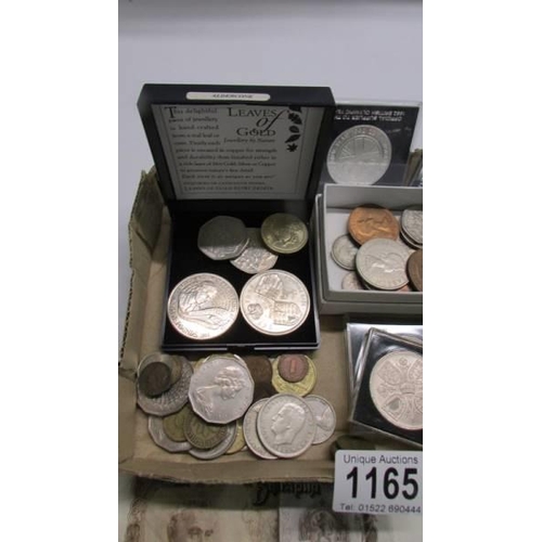 1165 - A quantity of coins including silver threepenny bits, £5 coins, 50p coins etc.,