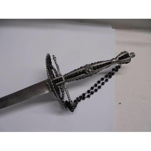 1182 - A steel court sword with beaded hilt and faceted stud decoration.