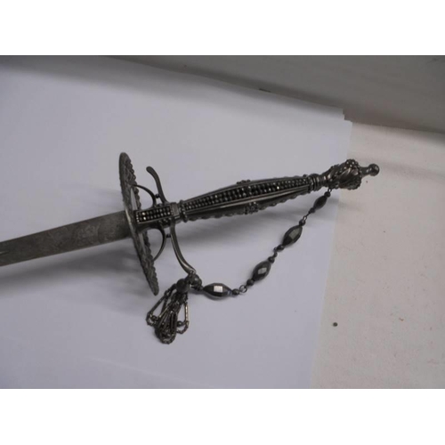 1183 - A steel court sword with beaded hilt and faceted stud decoration.