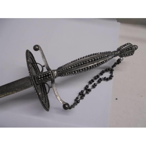 1184 - A steel court sword with beaded hilt and faceted stud decoration.