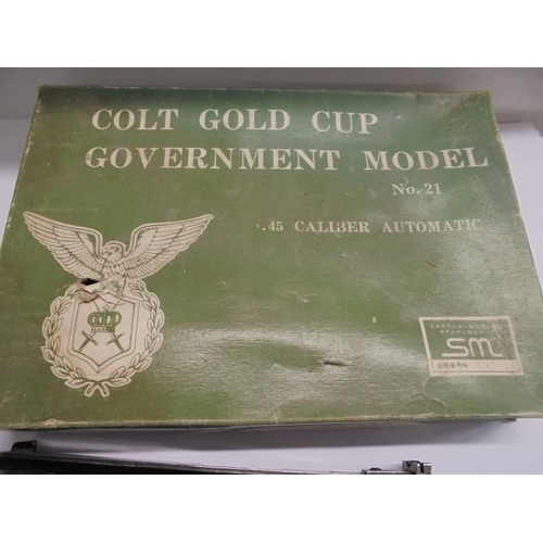 1186 - A Colt Gold Cup Government model No. 21 .45 calibre automatic pistol with box lid.