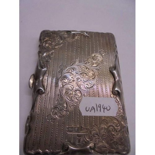 1190 - A ornate silver monogrammed Walker & Hall card case complete with pencil, dated 1915.