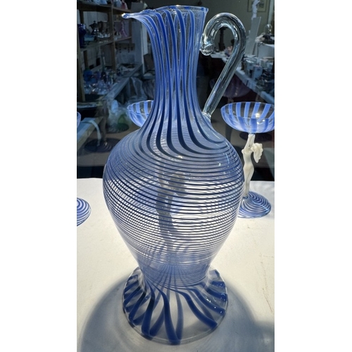 1245 - An art deco glass & decanter set with blue swirls & nude figurine stems