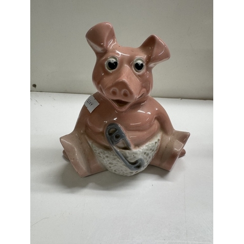 1246 - A quantity of Wade Nat West pig money boxes