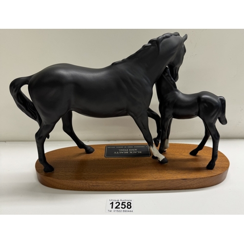 1258 - A Beswick black beauty & foal horse group