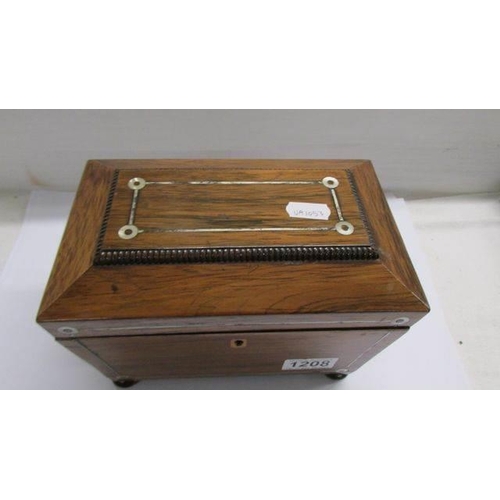 1208 - A Victorian mahogany tea caddy.