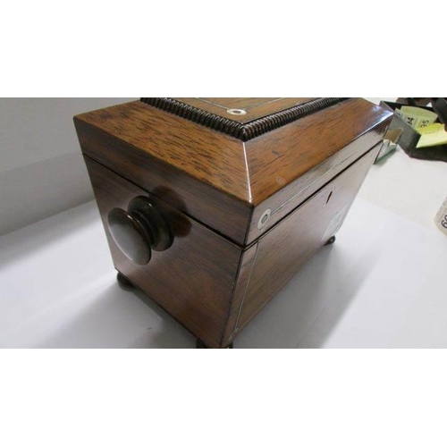 1208 - A Victorian mahogany tea caddy.