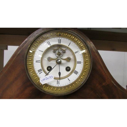 1219 - A mahogany inlaid clock with domed top.