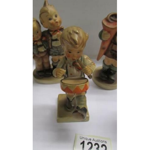 1232 - Five assorted Hummel child figures.