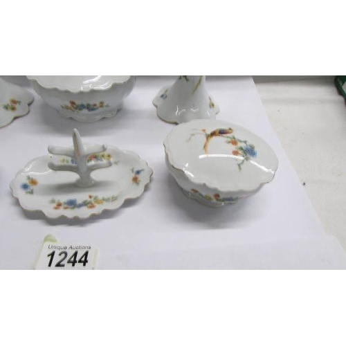 1244 - A six piece dressing table trinket set decorated birds.