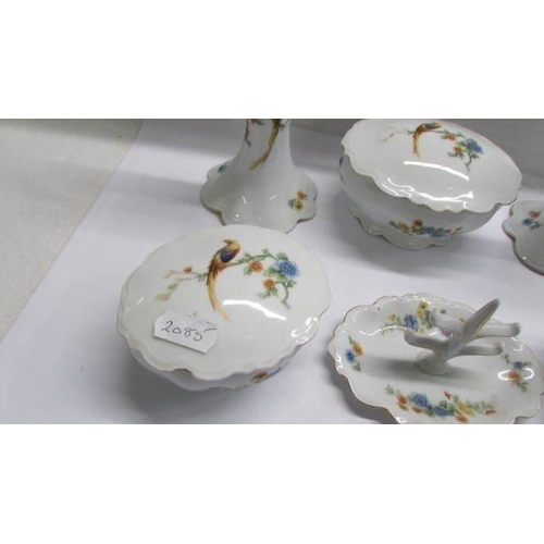 1244 - A six piece dressing table trinket set decorated birds.