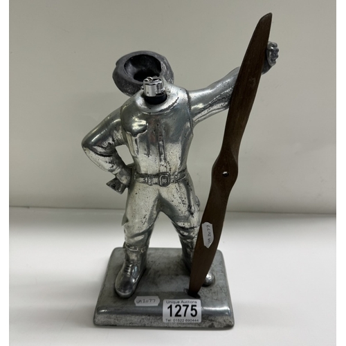 1275 - A table lighter in the form of a pilot holding a propellor