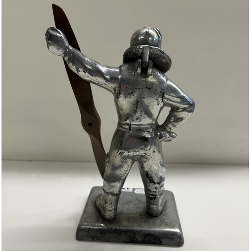 1275 - A table lighter in the form of a pilot holding a propellor