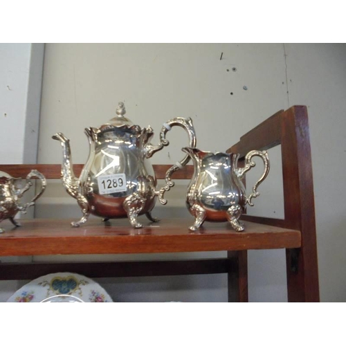 1289 - A four piece silver plate tea set with cone finials.