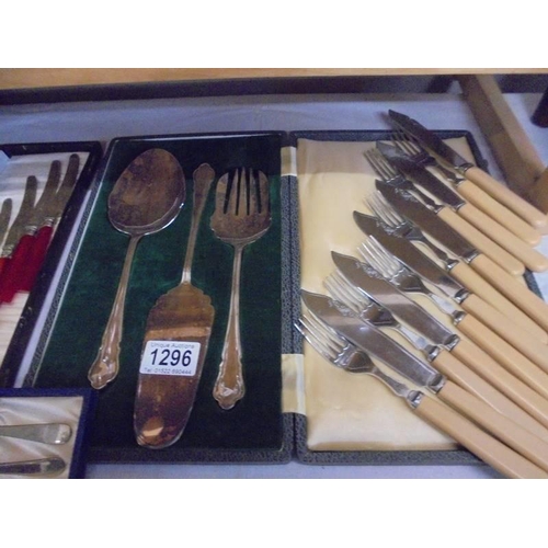 1296 - A quantity of cased cutlery sets and other cutlery.