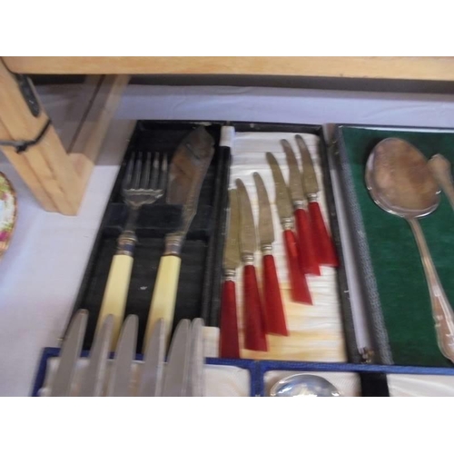 1296 - A quantity of cased cutlery sets and other cutlery.