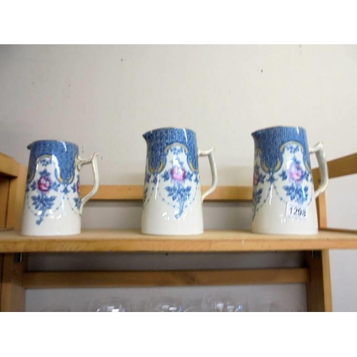 1298 - A set of three Winkle & Co., 'Clyde' pattern graduated jugs.