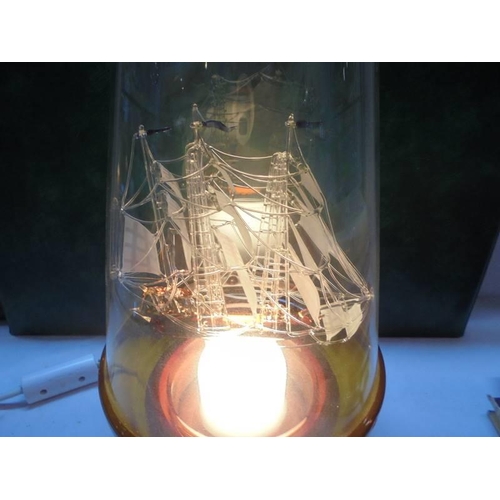 1307 - A table lamp in the form of a glass galleon in a bottle. COLLECT ONLY.