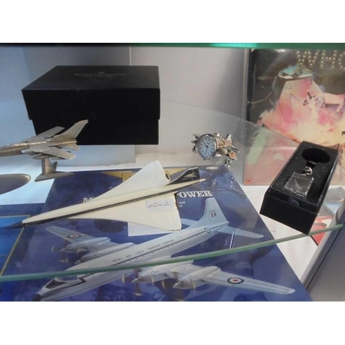 1335 - A selection of aviation related models and ornaments, 2 shelves.