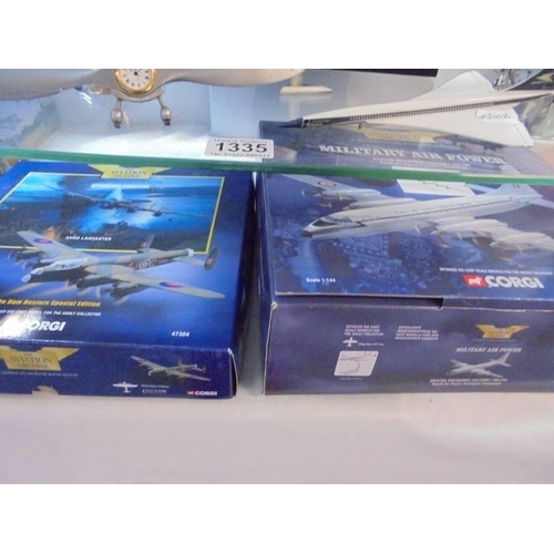 1335 - A selection of aviation related models and ornaments, 2 shelves.