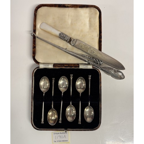 1190A - A cased set of silver spoons etc