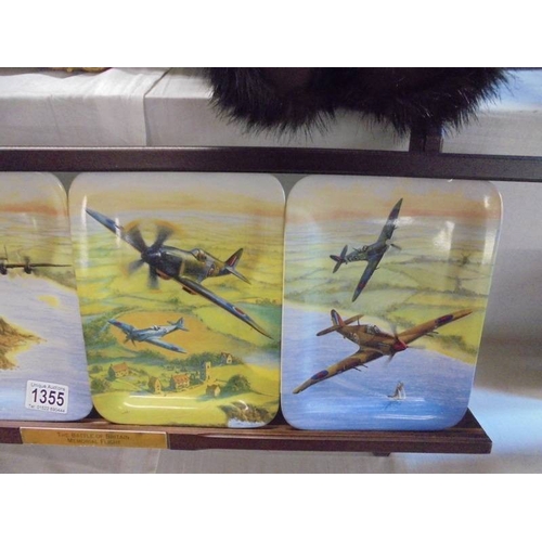 1355 - A set of four 'The Battle of Britain Memorial Flight' plates on stand.