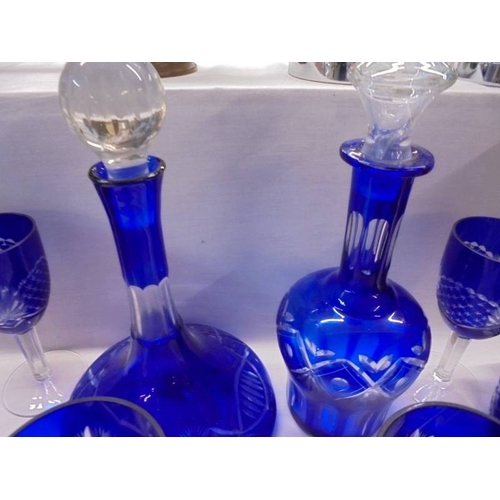 1387 - Two Blue glass Bohemian style decanter with a set of six wine glasses.