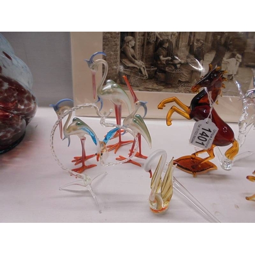 1401 - A quantity of assorted glass animals etc.,