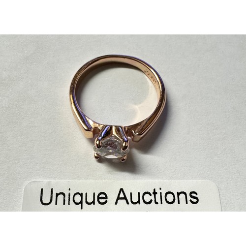 1040 - An 18ct gold plated ring set white stone.