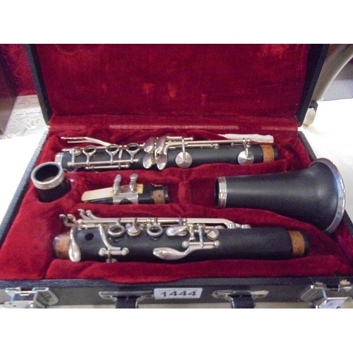 1444 - A cased clarinet.