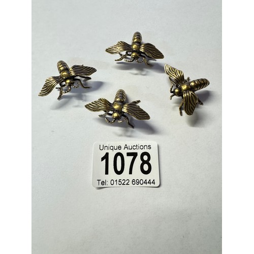 1078 - Four unusual brass bees.