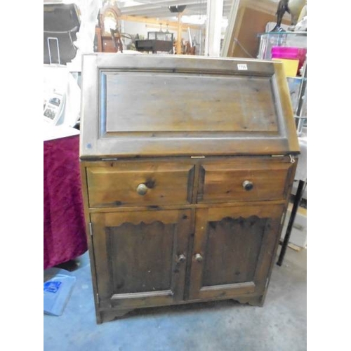 1700 - A stained pine two door bureau.