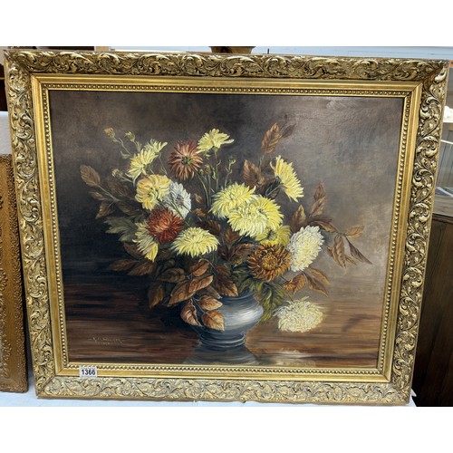 1366 - A gilt framed oil on board painting of a floral arrangement,