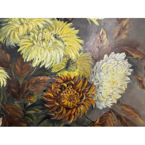 1366 - A gilt framed oil on board painting of a floral arrangement,