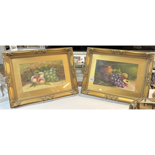 1372 - A pair of framed and glazed still life paintings featuring fruit, signed but indistinct.