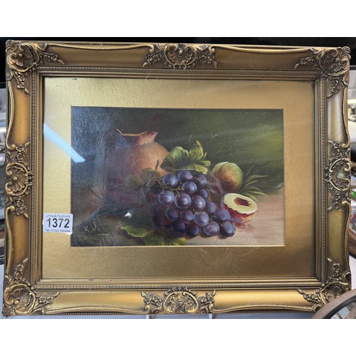 1372 - A pair of framed and glazed still life paintings featuring fruit, signed but indistinct.