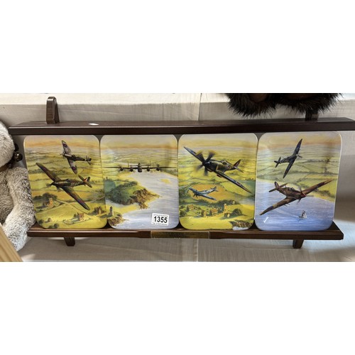 1355 - A set of four 'The Battle of Britain Memorial Flight' plates on stand.