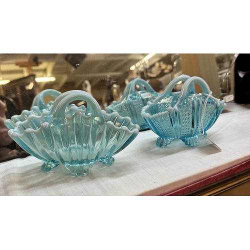 1365 - Two pretty blue glass baskets.