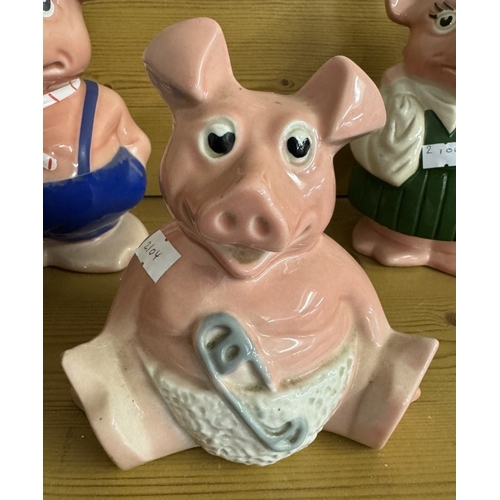 1004 - A quantity of Wade Nat West pig money boxes