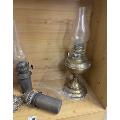 1006 - A selection of brass oil lamps etc