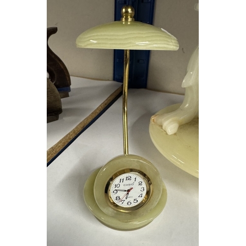 1040 - A marble dolphin tea light stand and a decorative marble clock