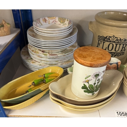 1058 - A good lot of Kitchenalia including Pyrex dishes, jelly moulds etc (on 2 shelves)